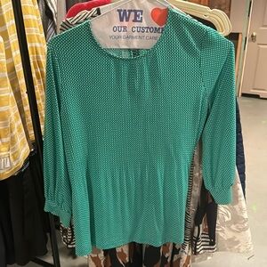 green blouse with flounces